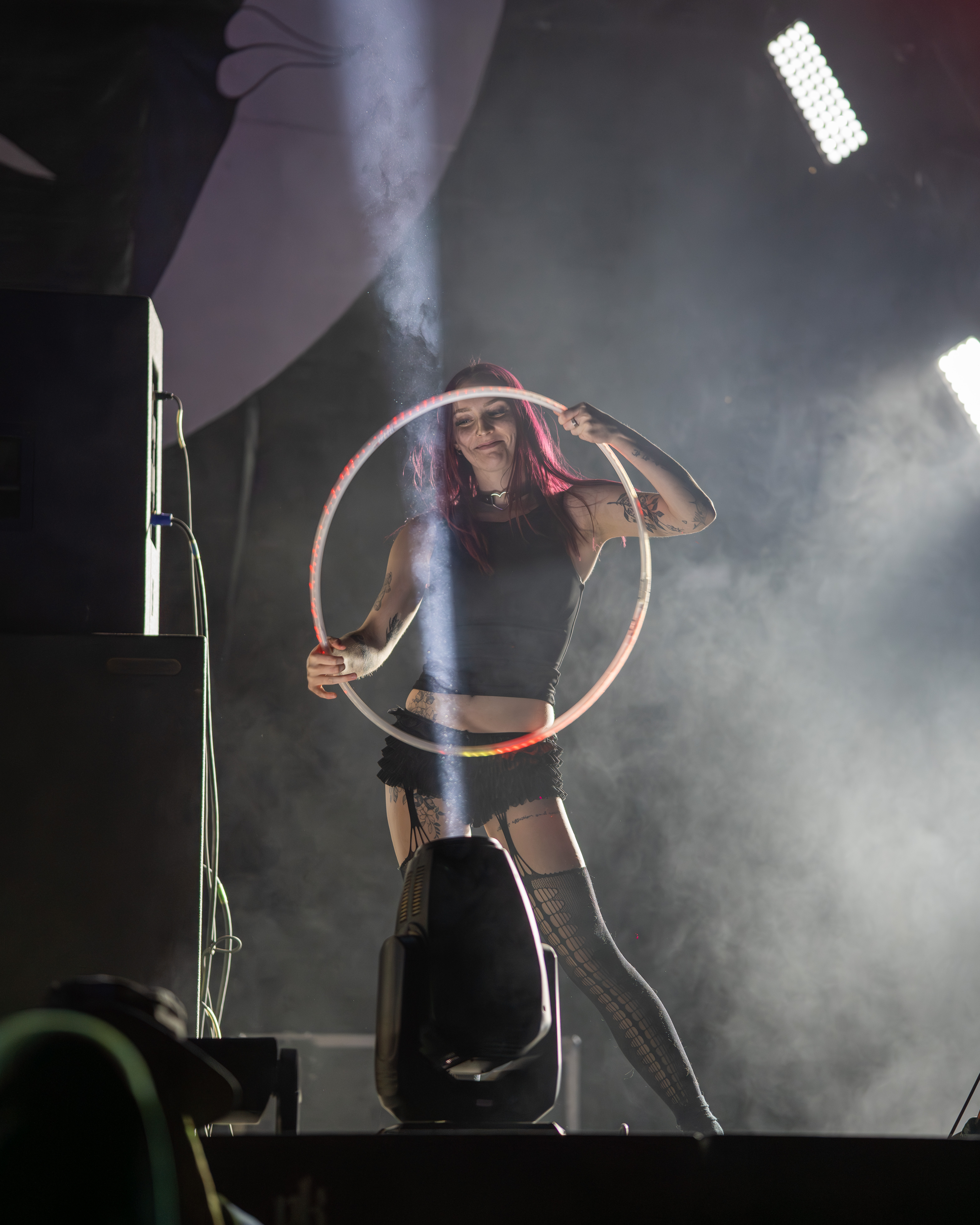 A group of people practising flow arts with different props
